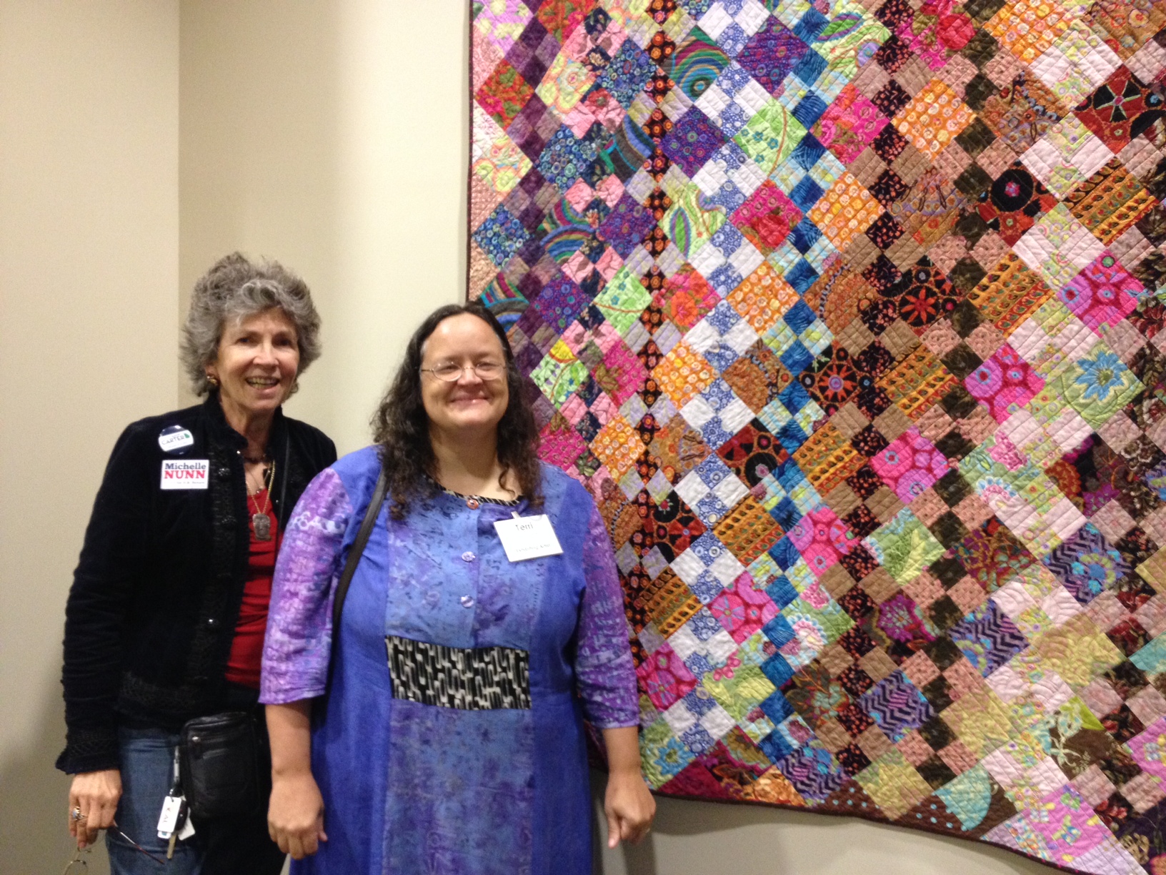 Terri Jarrett shows her work 'Don't Let Go' to Gwen O'Looney.JPG