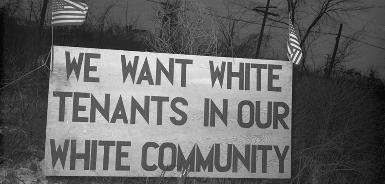 A sign declaring "We Want White Tenants in Our White Community"